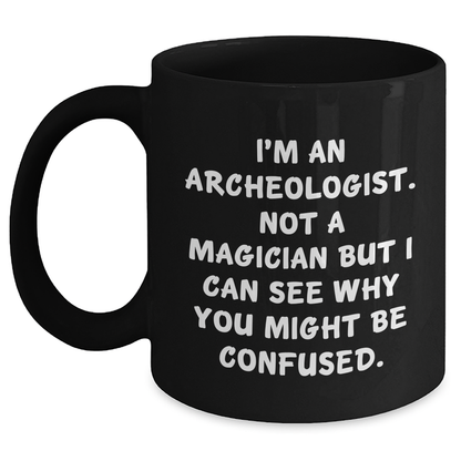 Funny Archeologist Gifts for Men, Black Coffee Mug with 'I'm An Archeologist. Not A Magician' Quote, Gifts from Friends, Family, or Coworkers for Father's Day - Victory Thru Vision 