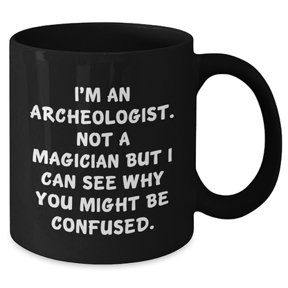 Funny Archeologist Gifts for Men, Black Coffee Mug with 'I'm An Archeologist. Not A Magician' Quote, Gifts from Friends, Family, or Coworkers for Father's Day - Victory Thru Vision 
