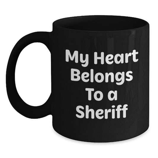 Funny Sheriff Gifts for Valentine's - 'My Heart Belongs To A Sheriff' Black Coffee Mug, Perfect for Sheriff Lovers, Sheriff Enthusiasts, Sheriff Wife, Sheriff Husband, or Sheriff Friends - Main
