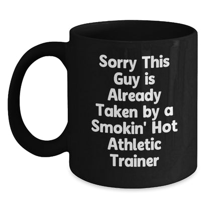 Funny Athlete Trainer Gifts, Sorry This Guy Is Already Taken By A Smokin' Hot Athletic Trainer Quote, Black Coffee Mug, Perfect Graduation Gift from Friends to Colleagues - Main