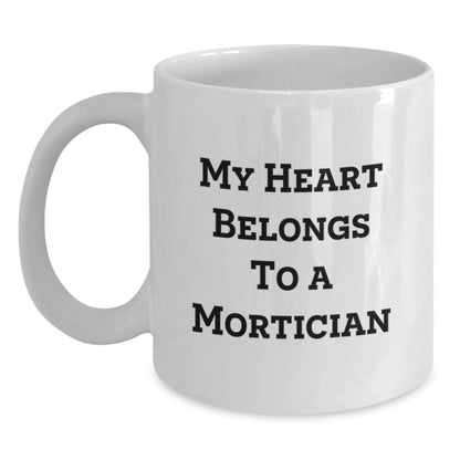 Funny My Heart Belongs To A Mortician White Coffee Mug Gifts from Men to Mortician Friends - Main