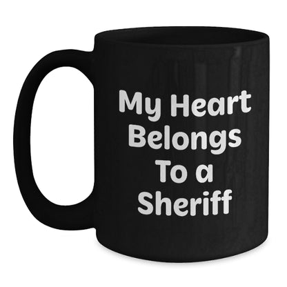 Funny Sheriff Gifts for Valentine's - 'My Heart Belongs To A Sheriff' Black Coffee Mug, Perfect for Sheriff Lovers, Sheriff Enthusiasts, Sheriff Wife, Sheriff Husband, or Sheriff Friends - Main