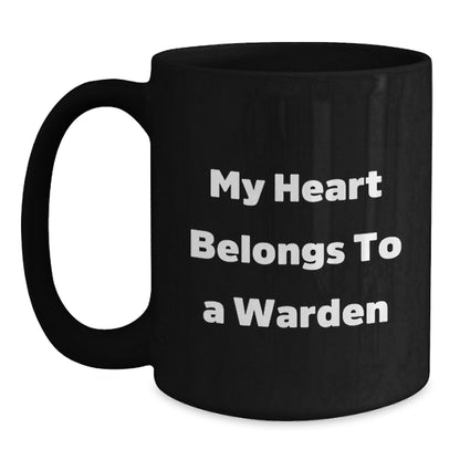 Funny Warden Gifts from Friends and Family, Black Coffee Mug with Quote 'My Heart Belongs To A Warden' for Warden Lovers, Christmas Unique Gifts - Main