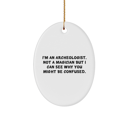 Archeologist Gifts from Friends for Christmas - Oval Ornament with Funny Quote, 'I'm An Archeologist. Not A Magician But I Can See Why You Might Be Confused.' - Victory Thru Vision 