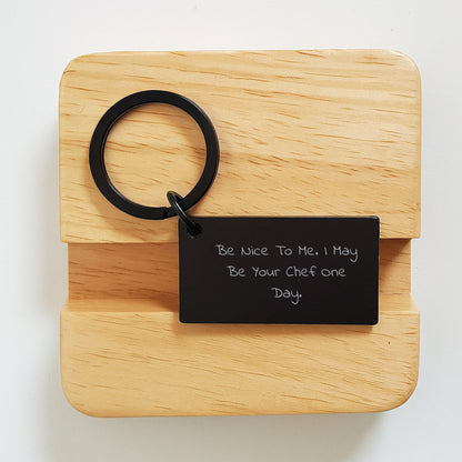 Funny Chef Keychain Gifts from Friends to Men or Women on Birthday, 'Be Nice To Me. I May Be Your Chef One Day.', Stainless Steel, Black Color, 1.57 x 0.87 inches, Engraved Message - Victory Thru Vision
