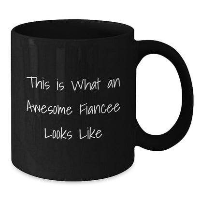 Funny Fiancee Gifts from Men to Women - This Is What An Awesome Fiancee Looks Like Black Coffee Mug for Graduation, Unique Gifts for Fiancee - Victory Thru Vision