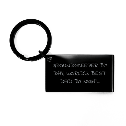groundskeeper Gifts, Funny Keychain for Mother's Day, 'groundskeeper By Day, World's Best Dad By Night' Quote, Stainless Steel, Black, 1.57 x 0.87 inches, Gifts from Men, Gifts for groundskeeper - Victory Thru Vision