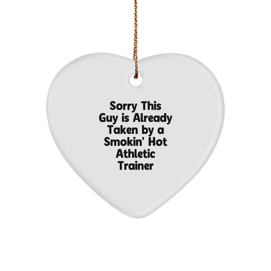 Funny Athletic Trainer Heart Ornament Gifts from Friends for Christmas, 'Sorry This Guy Is Already Taken By A Smokin' Hot Athletic Trainer', Heart Shaped, White Color - Image 1