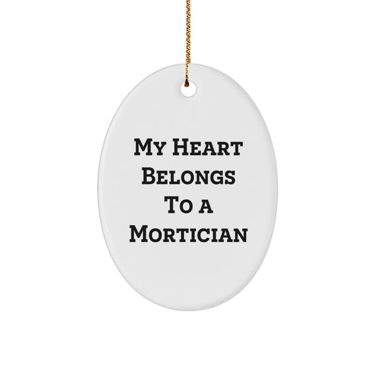Funny Mortician Gifts from Friends, Unique Oval Ornament for Christmas Unique Gifts, My Heart Belongs To A Mortician Lover - Image 1