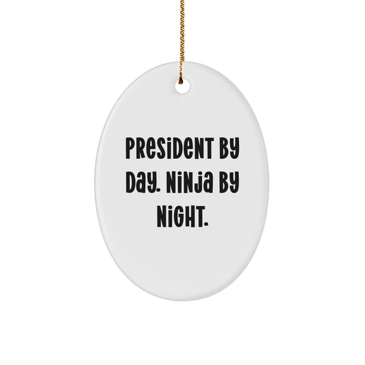 President Gifts for Him, Oval Ornament Christmas Unique Gifts from Friends, 'President By Day. Ninja By Night.' Funny Quote - Image 1