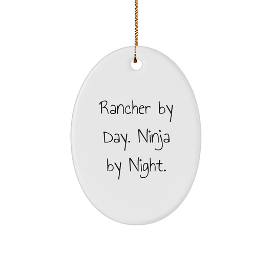 Funny Rancher Gifts from Friends for Men, Oval Christmas Ornaments, Rancher By Day. Ninja By Night. - Image 1