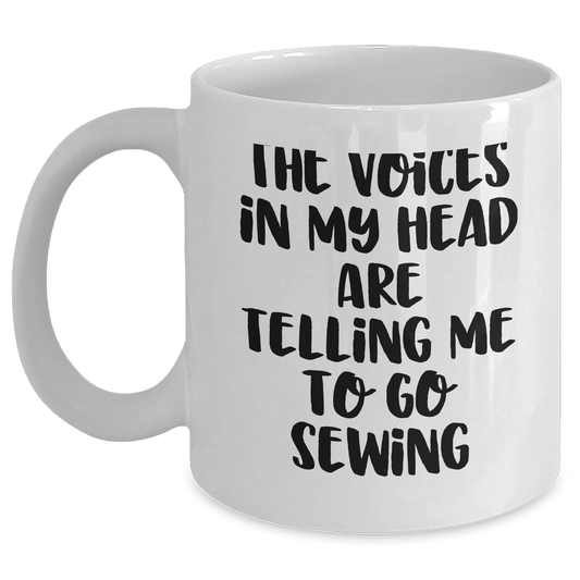 Sewing Inspiration Funny Gifts for Sewing Enthusiasts, White Coffee Mug with Quote 'The Voices In My Head Are Telling Me To Go Sewing', Gifts from Family to Friends - Victory Thru Vision