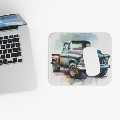 Mouse pad with vintage 1955 Chevy truck illustration, rustic office decor on white desk.
